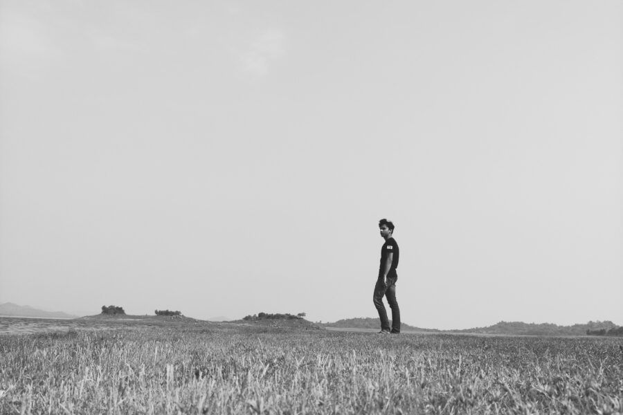Man in field feeling the plateau effect