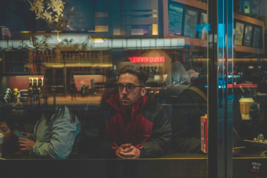 Man in cafe struggling with euphoric recall