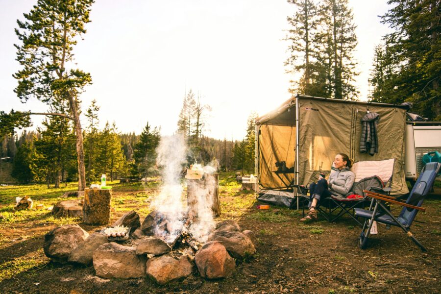 Woman using self soothing techniques around the campfire