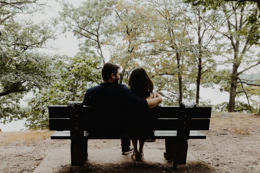 couple on bench, thinking about signs a spouse is on drugs
