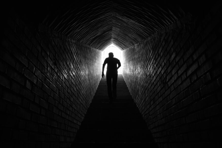 I man climbing stairs as he works on alcohol relapse recovery