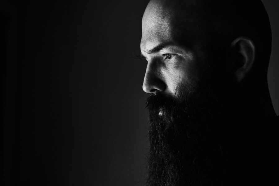 Bearded man struggling with ACEs trauma