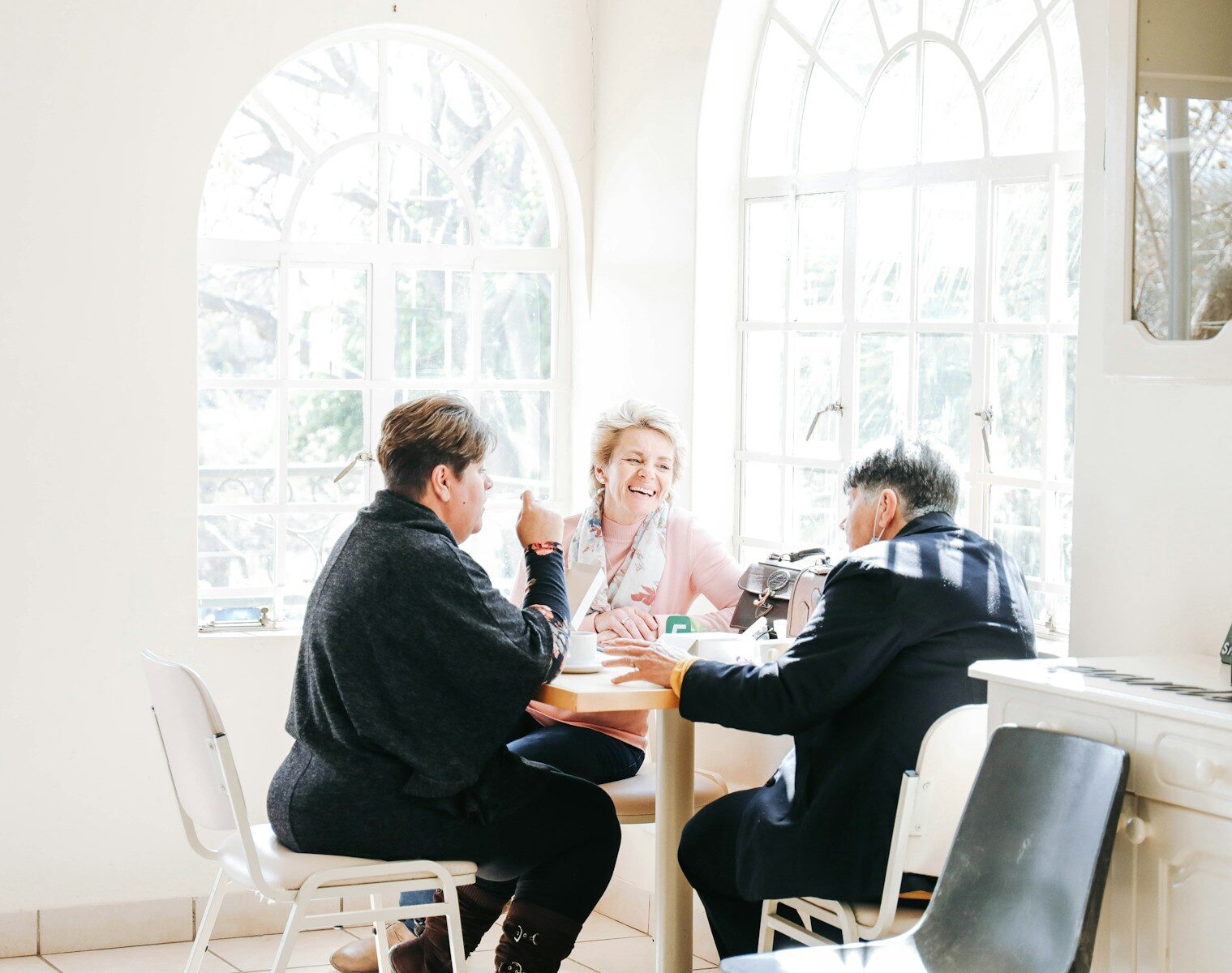 a group of people sitting around a table discussing addiction and lying