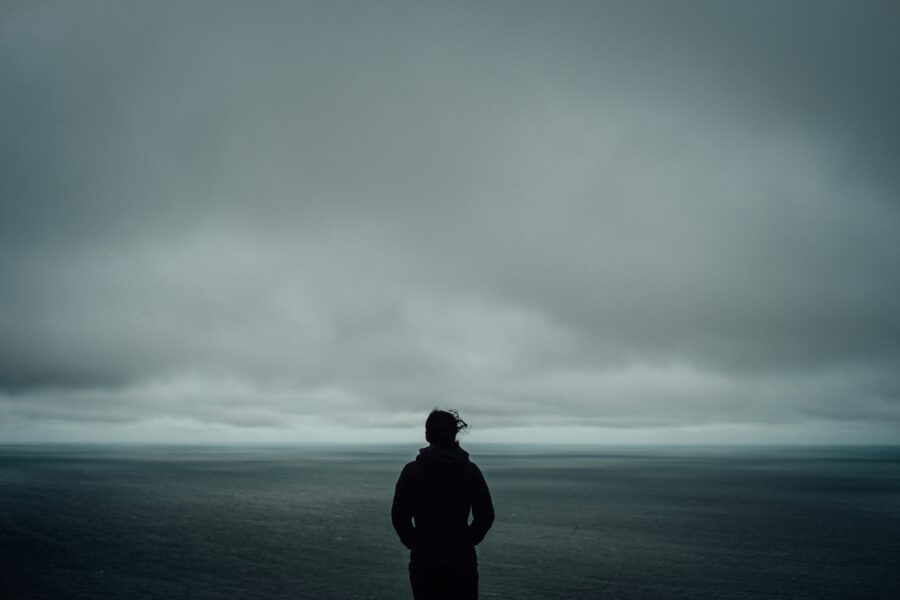 Solitary woman struggling with one of the types of bipolar disorder