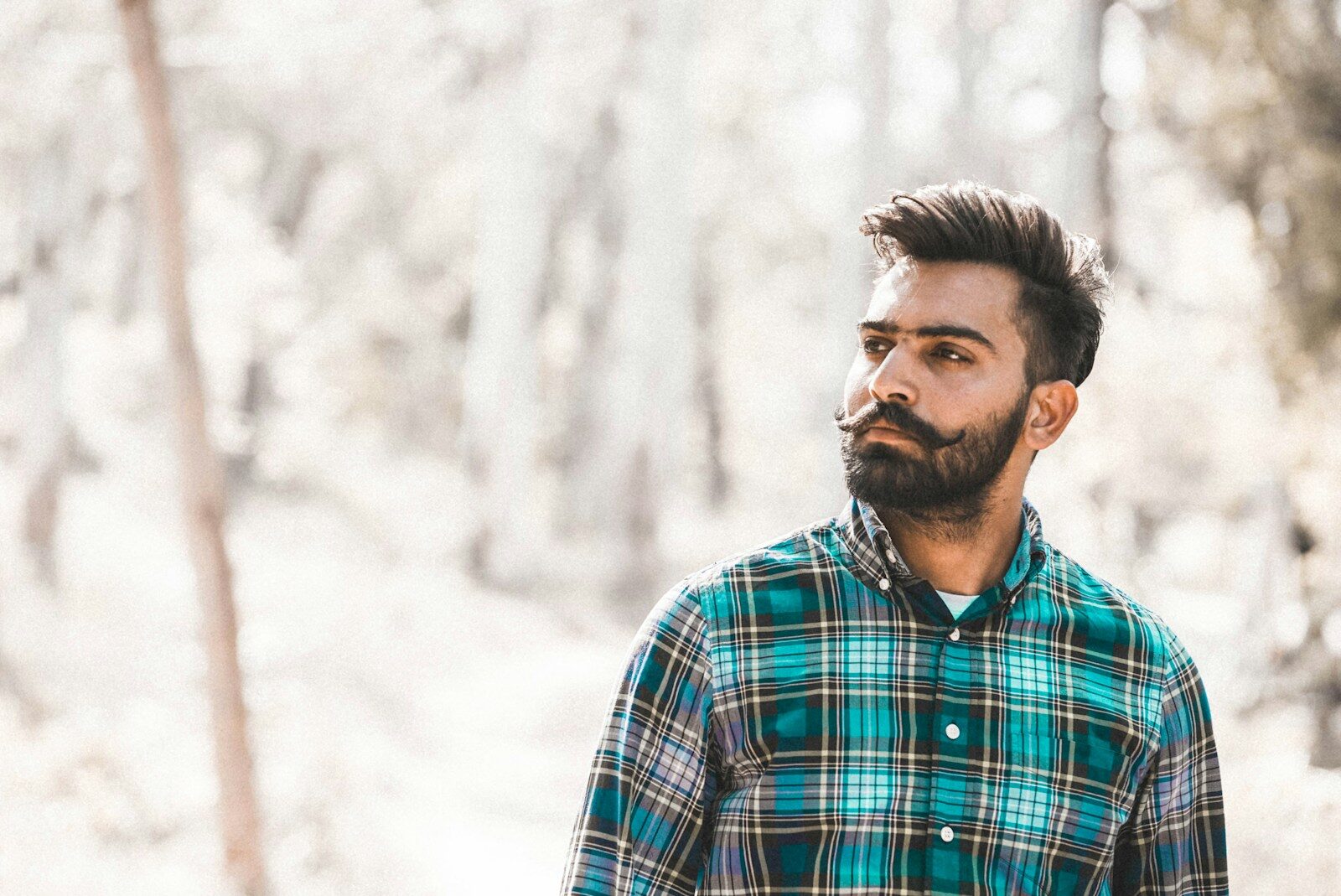 man struggling with lapse vs relapse standing near woods